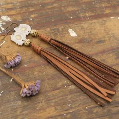 leather tassel and antler charm earrings